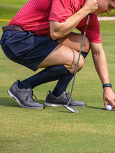Load image into Gallery viewer, Man Golfing wearing Sigvaris Sea Island Cotton Compression Socks 
